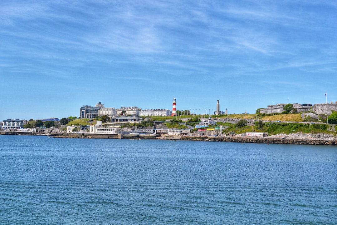 City Centre, Plymouth: a body of water with a lighthouse on a hill in the background